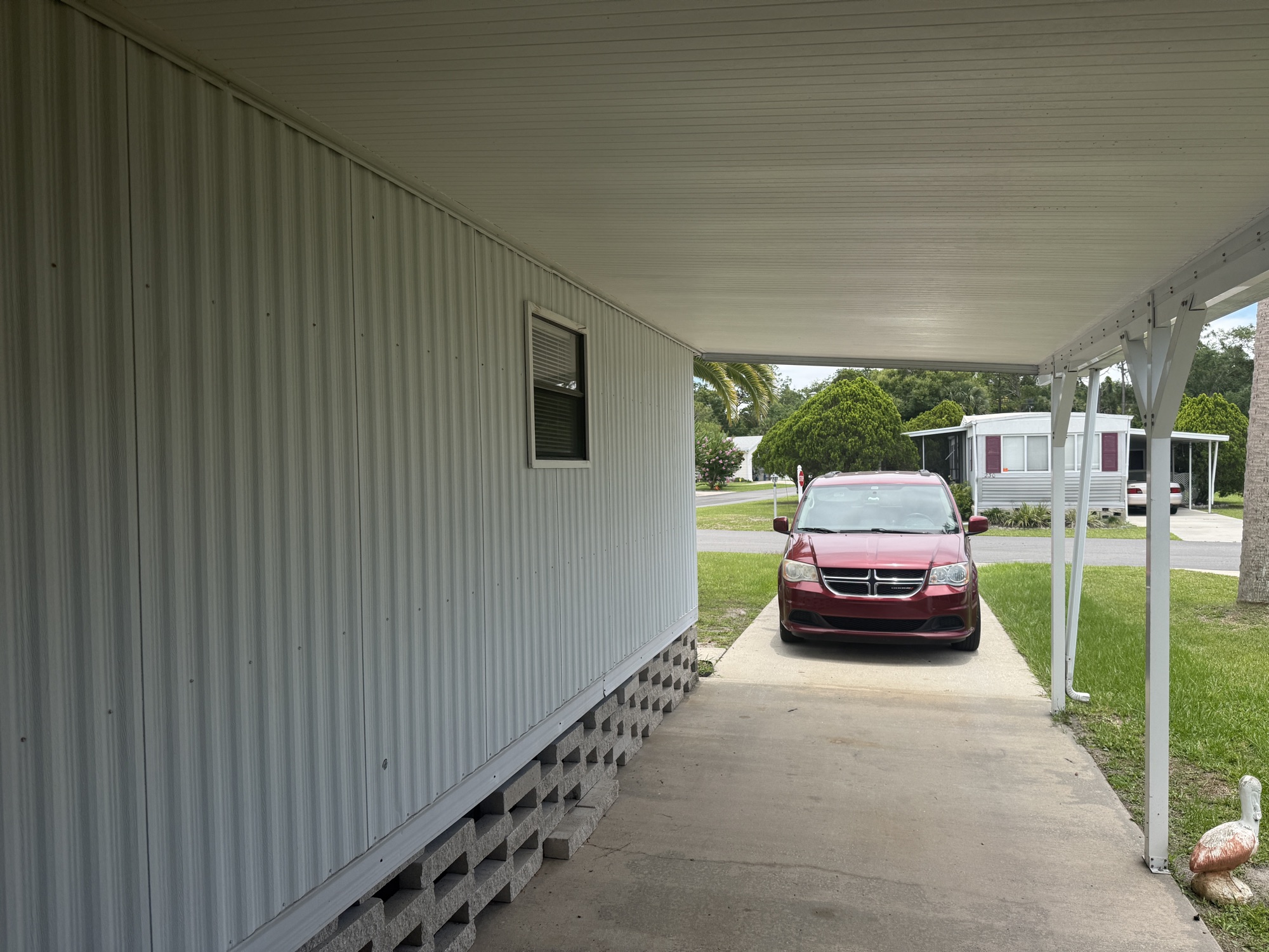Long covered carport with room to park