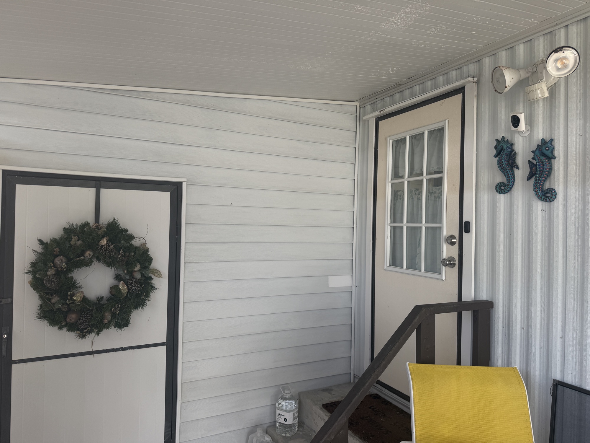 Covered front entry and screened porch