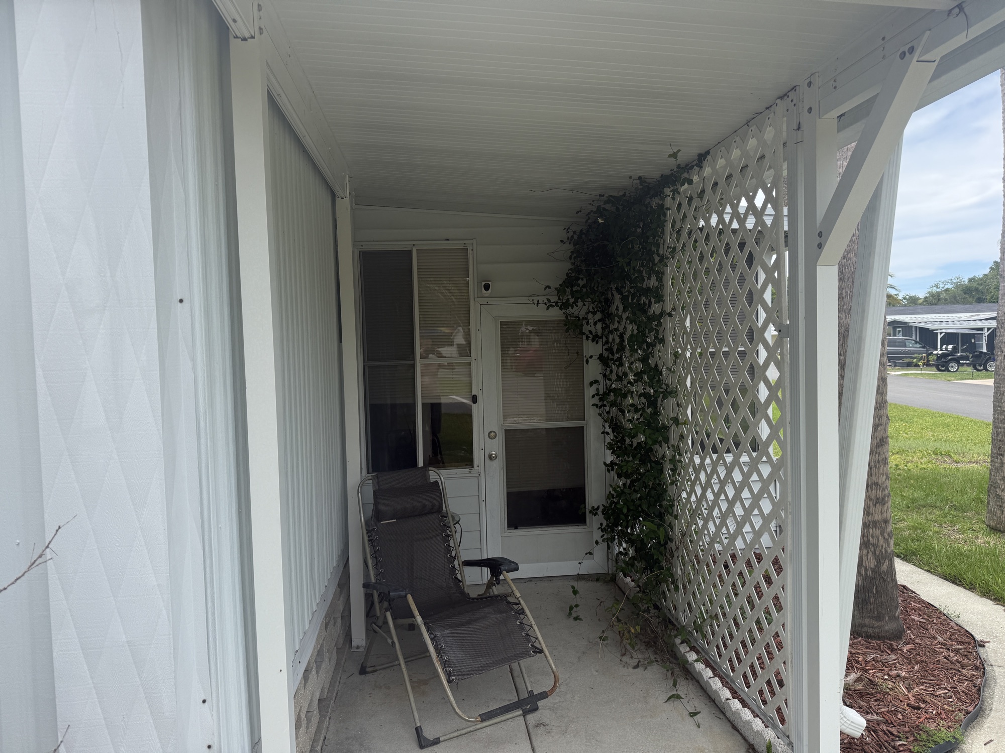 Private side patio with lattice privacy screen