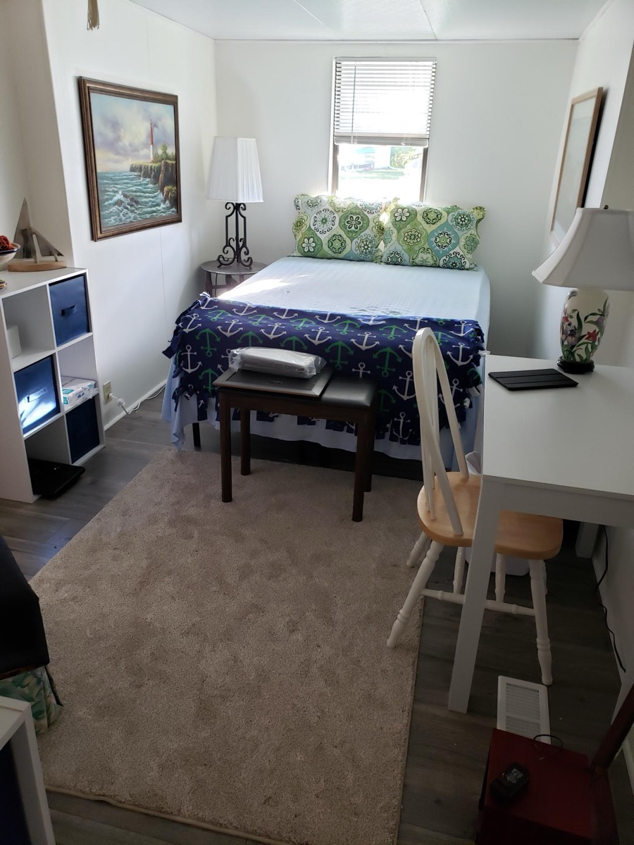 Spacious second bedroom with carpet and dual closets